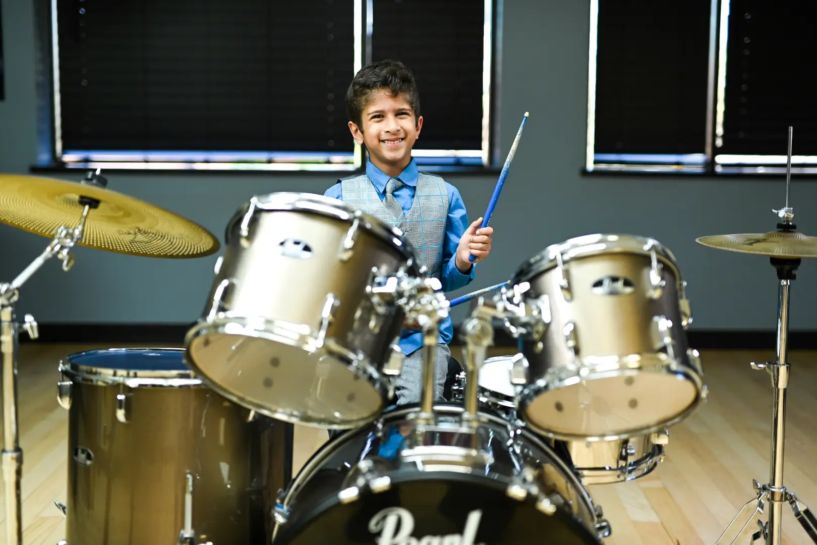 Boy taking drum lessons in in Mandeville, LA