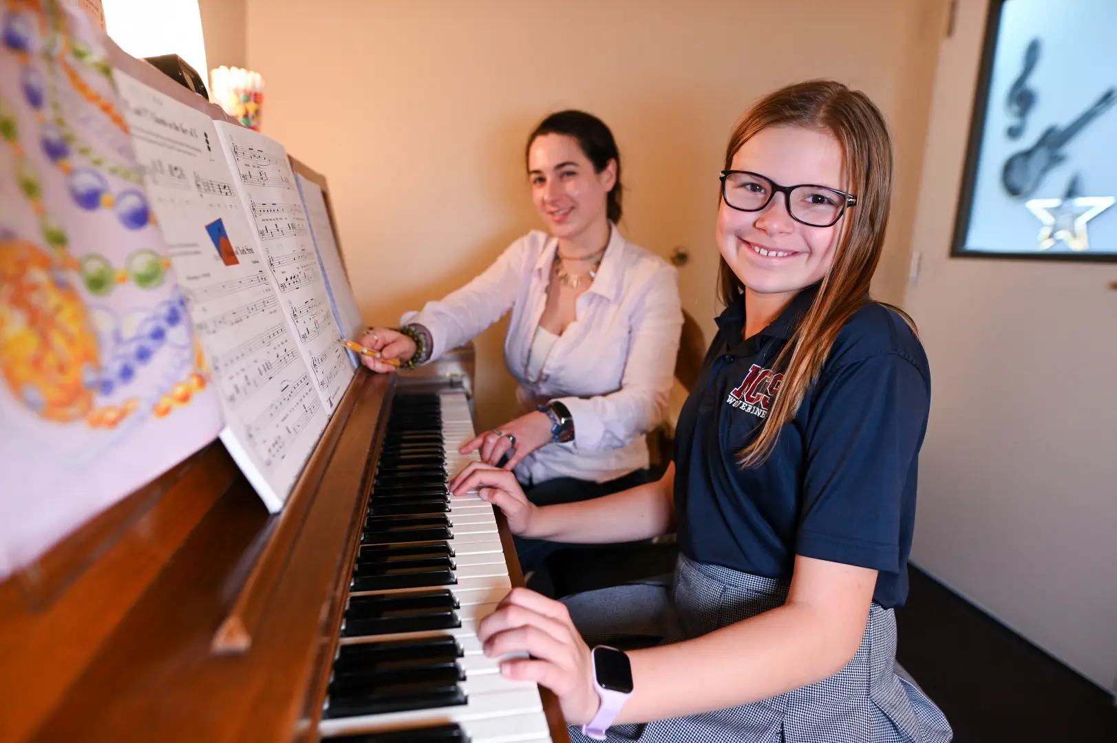 Student taking a piano lesson at LAAPA in Mandeville