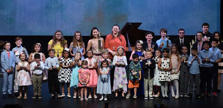 Music Students showing off their awards at a LAAPA Music Concert in Metairie and Mandeville, LA