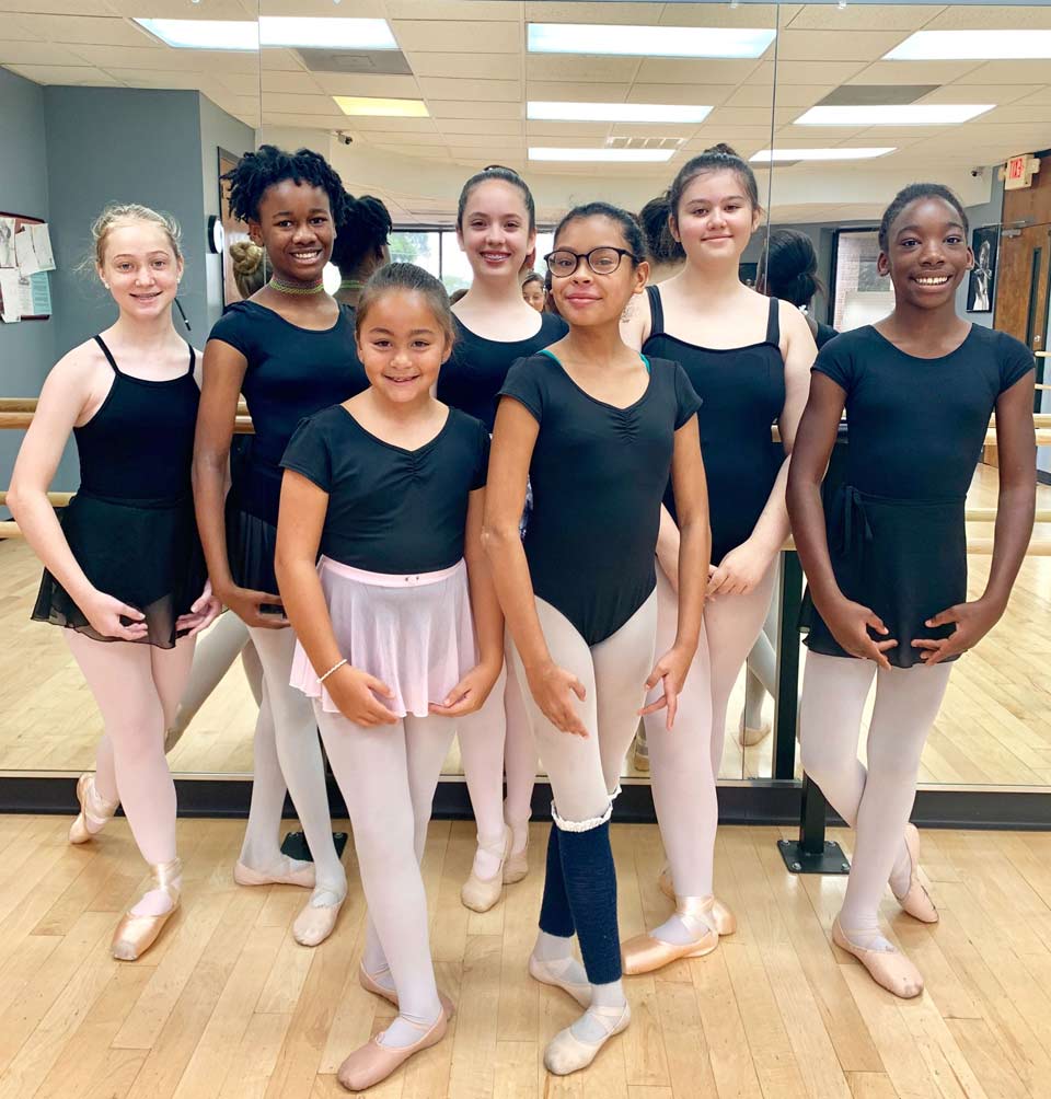 Children in Elmwood learning to dance during Ballet class.