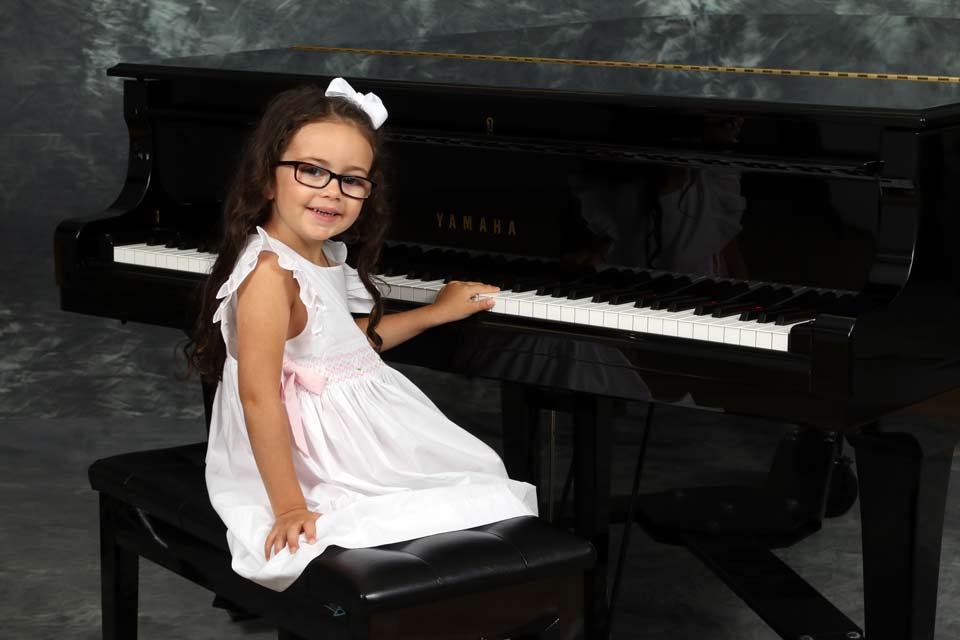 Kid playing the piano in Metairie, LA