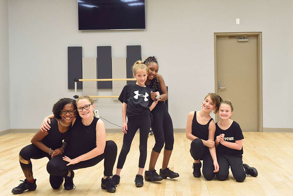 Kids in New Orleans learning to dance during Hip Hop class.