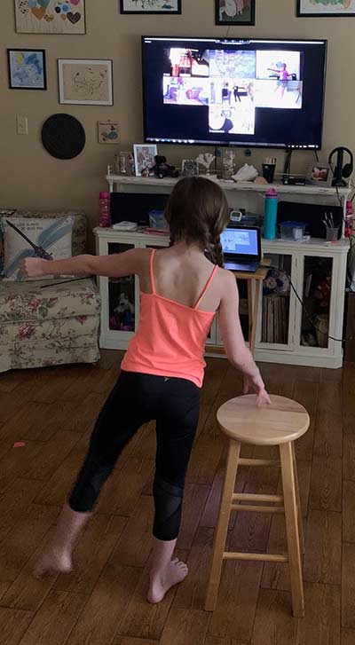 Students learning to dance online during her ballet class